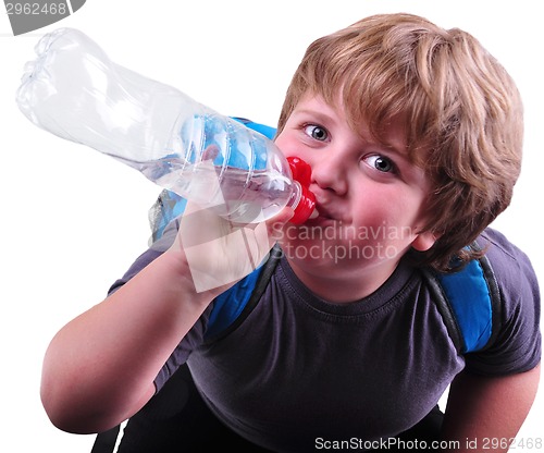 Image of closeup portrait of kid drinking water