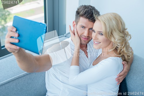 Image of Young White Couple Taking Self Photos