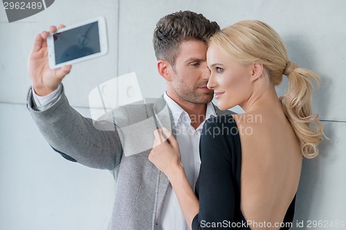 Image of Young Romantic Couple Taking Sweet Photos