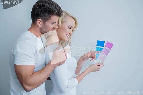 Image of Happy Couple Looking at Color Indicator Paper