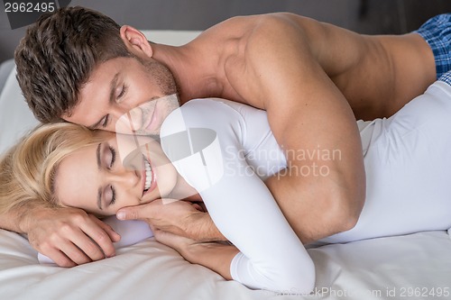Image of Smiling Middle Age Lovers Lying in Bed So Sweet