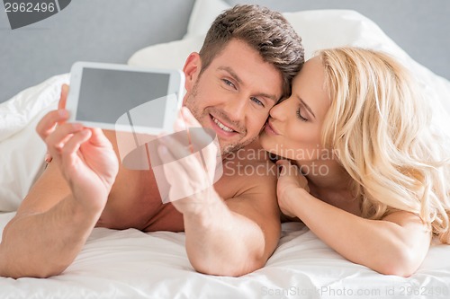 Image of Romantic Couple Capturing Moments