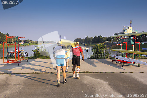 Image of Four rowers wear ship