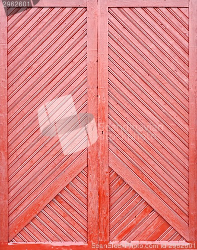 Image of red wooden plank door