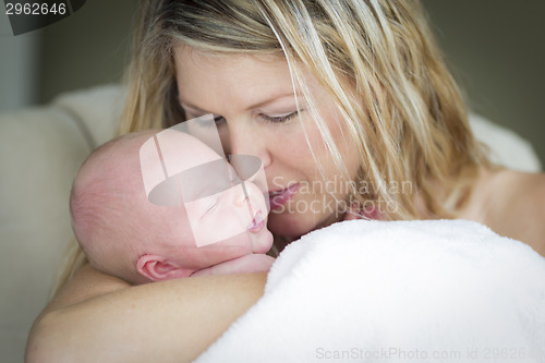 Image of Young Beautiful Mother Holding Her Precious Newborn Baby Girl