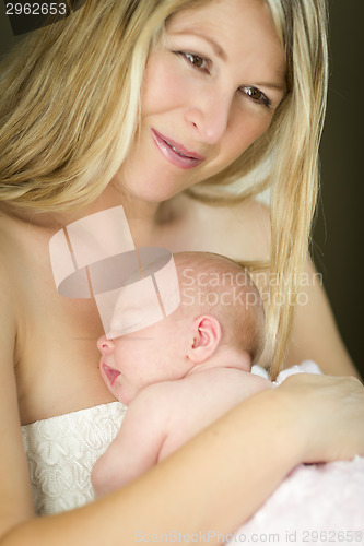 Image of Young Beautiful Mother Holding Her Precious Newborn Baby Girl