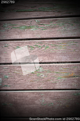 Image of weathered reddish wooden planks texture