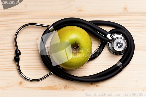 Image of Stethoscope and apple