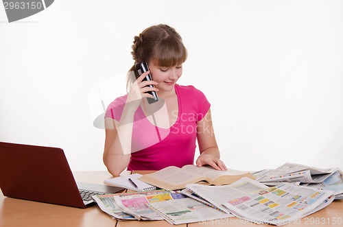 Image of Girl with a positive attitude to the employer calls