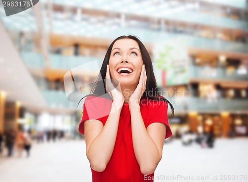 Image of smiling woman in red dress