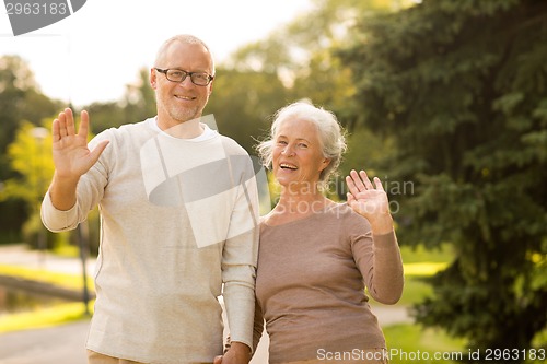 Image of senior couple hugging in city park