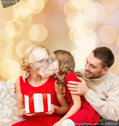 Image of happy family with gift box