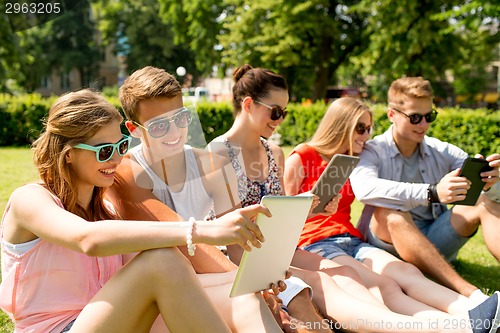 Image of smiling friends with tablet pc making selfie