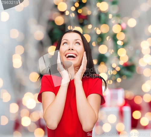 Image of smiling woman in red dress