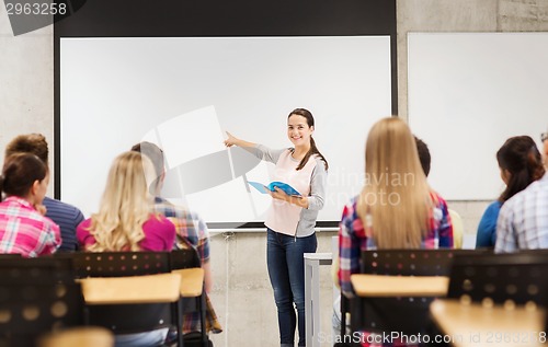 Image of group of smiling students in classroom