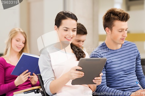 Image of group of smiling students with tablet pc