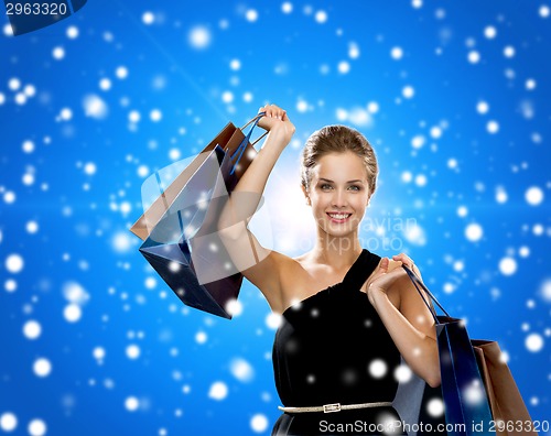 Image of smiling woman with shopping bags