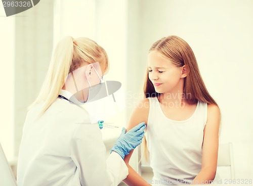 Image of doctor doing vaccine to child in hospital