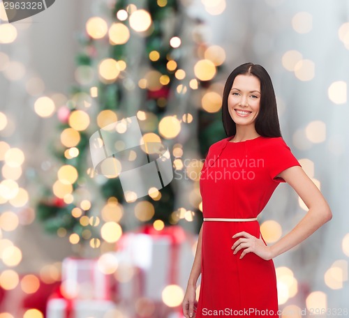 Image of smiling woman in red dress