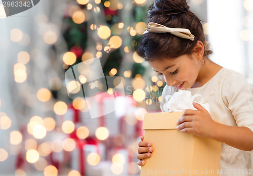 Image of smiling little girl with gift box