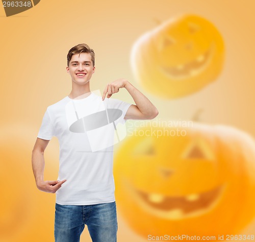 Image of smiling young man in blank white t-shirt