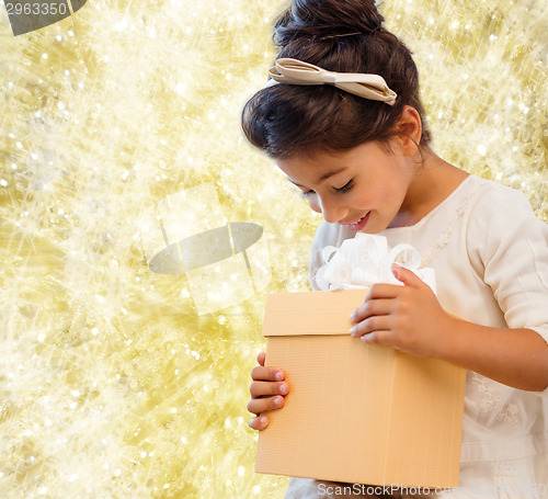 Image of smiling little girl with gift box