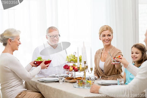 Image of smiling family having holiday dinner at home