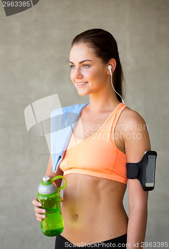 Image of woman with bottle of water in gym