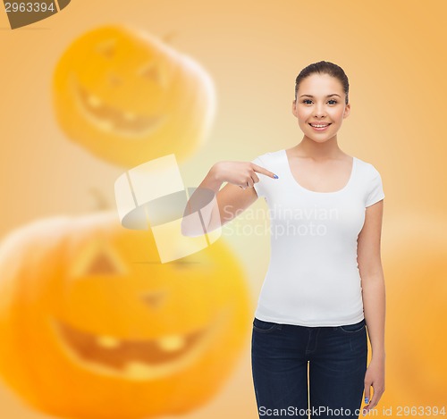 Image of smiling young woman in blank white t-shirt