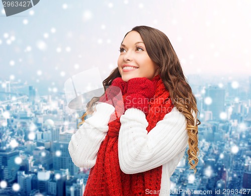 Image of smiling young woman in winter clothes