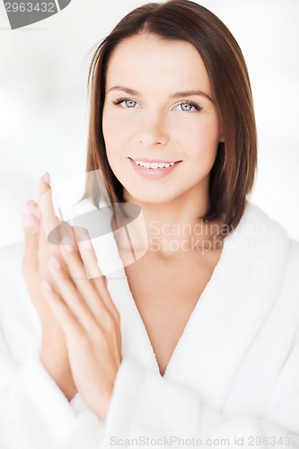 Image of beautiful woman in bathrobe