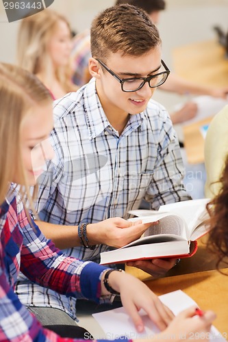 Image of group of smiling students with books