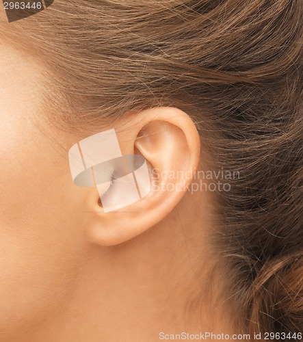 Image of close up of woman's ear