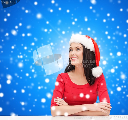 Image of smiling woman in santa helper hat