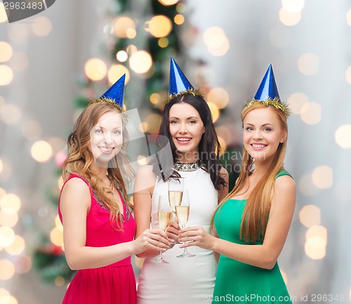 Image of smiling women holding glasses of sparkling wine