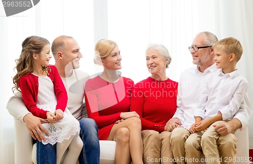 Image of smiling family at home
