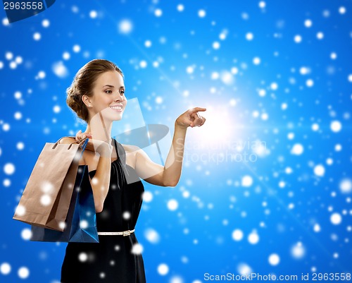 Image of smiling woman with shopping bags