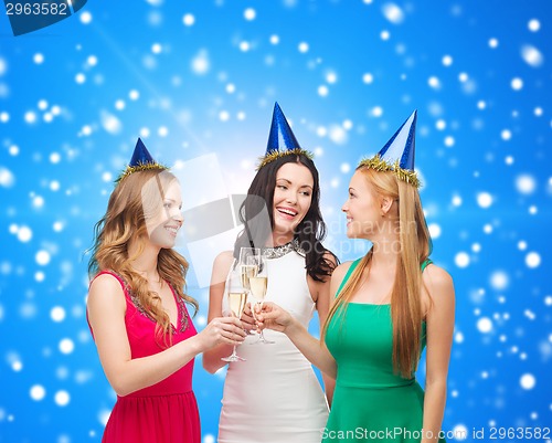 Image of smiling women holding glasses of sparkling wine