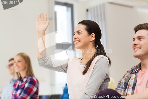 Image of group of smiling students in lecture hall