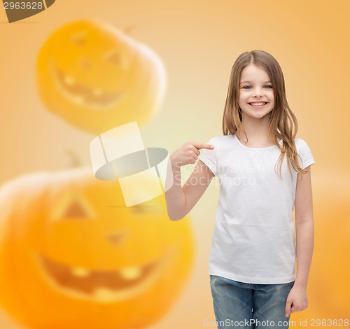 Image of smiling little girl in white blank t-shirt