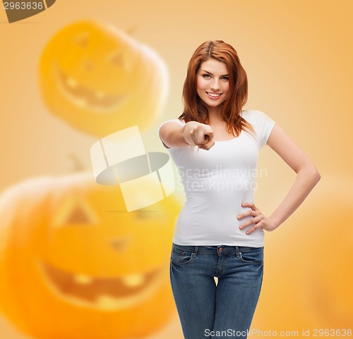 Image of smiling young woman in blank white t-shirt