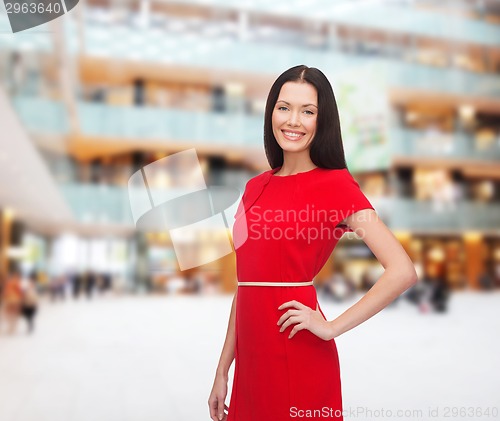 Image of smiling woman in red dress