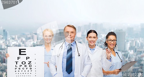 Image of smiling eye doctors and nurses