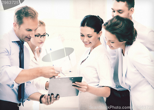 Image of business team discussing something in office