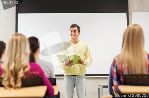 Image of group of smiling students in classroom