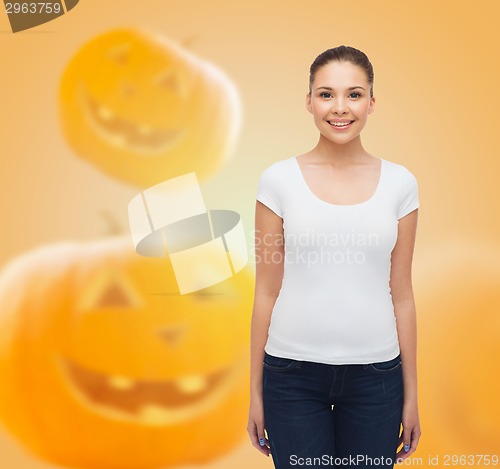 Image of smiling young woman in blank white t-shirt