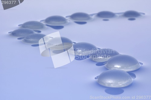Image of Glass pebbles on water

