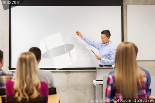 Image of group of students and teacher with notepad