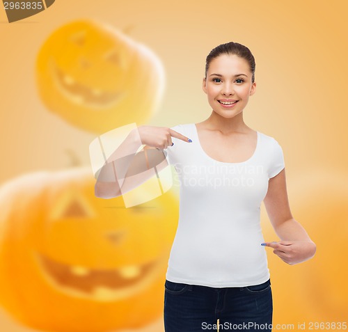 Image of smiling young woman in blank white t-shirt