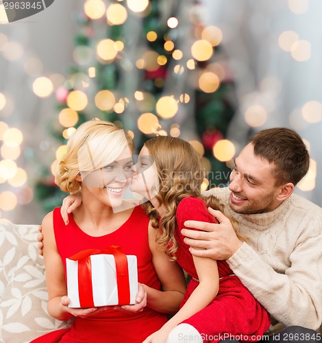 Image of happy family with gift box